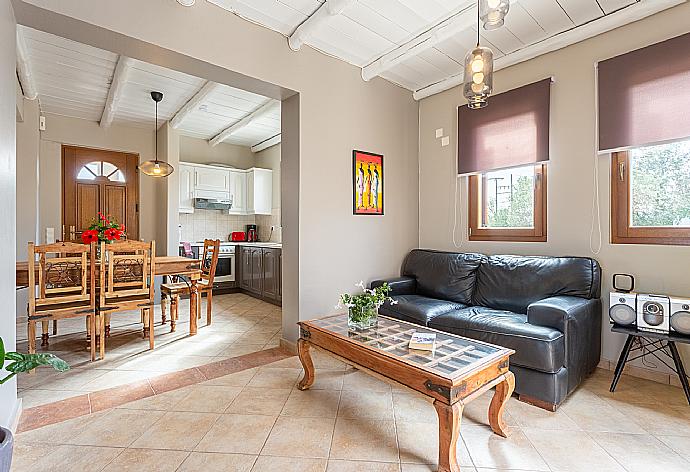 Open-plan living room with sofas, dining area, kitchen, WiFi internet, satellite TV, DVD player, and terrace access . - Villa Neria . (Galleria fotografica) }}