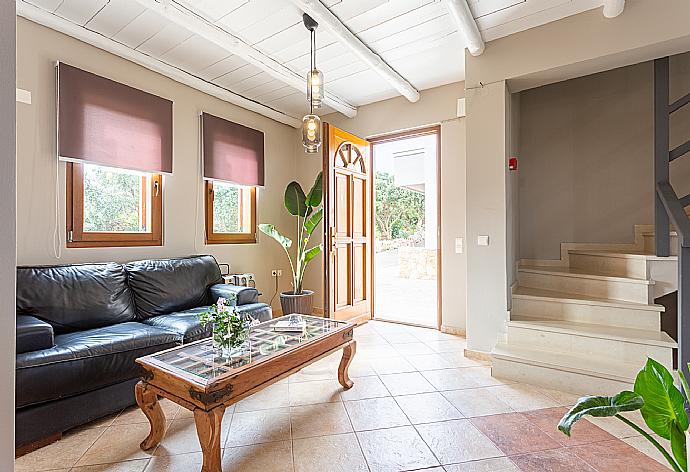 Open-plan living room with sofas, dining area, kitchen, WiFi internet, satellite TV, DVD player, and terrace access . - Villa Neria . (Galleria fotografica) }}