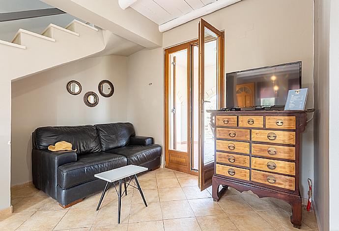 Open-plan living room with sofas, dining area, kitchen, WiFi internet, satellite TV, DVD player, and terrace access . - Villa Neria . (Galleria fotografica) }}