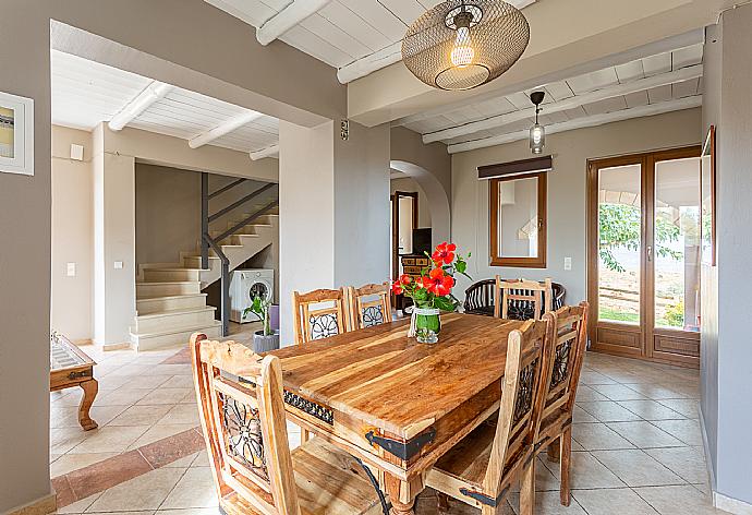 Open-plan living room with sofas, dining area, kitchen, WiFi internet, satellite TV, DVD player, and terrace access . - Villa Neria . (Galleria fotografica) }}