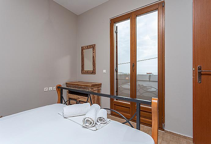 Double bedroom with A/C and balcony access . - Villa Neria . (Photo Gallery) }}