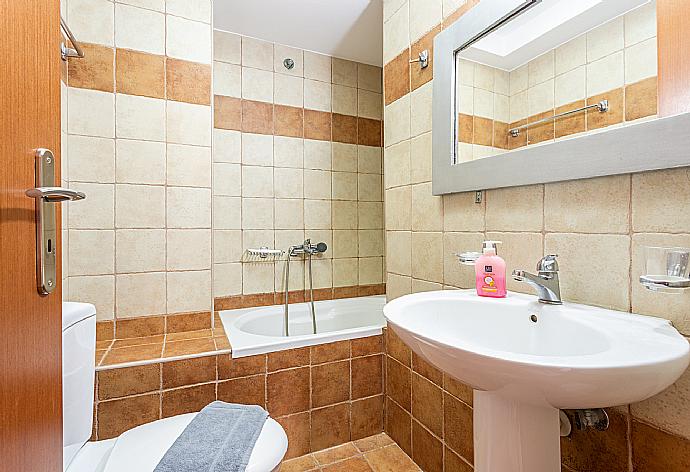 Family bathroom with bath and shower . - Villa Neria . (Photo Gallery) }}