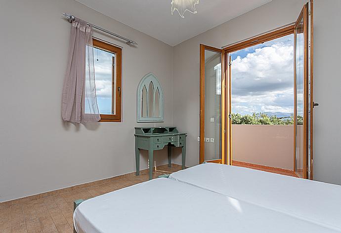 Twin bedroom with A/C and balcony access . - Villa Konstantina . (Photo Gallery) }}