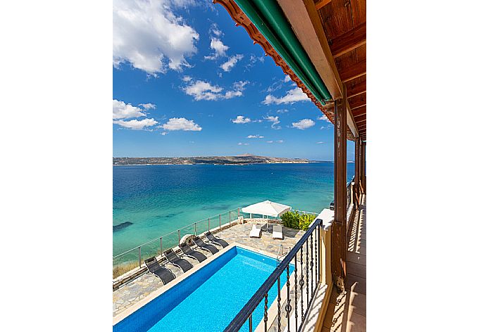 Sheltered balcony with outdoor seating and panoramic sea views . - Souda Bay View . (Photo Gallery) }}