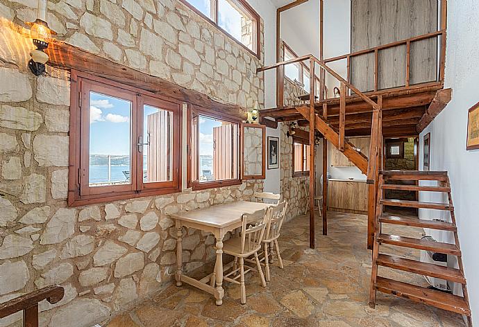 Self-contained apartment with open-plan living area, double bedroom on mezzanine, and pool-terrace access  . - Souda Bay View . (Galería de imágenes) }}