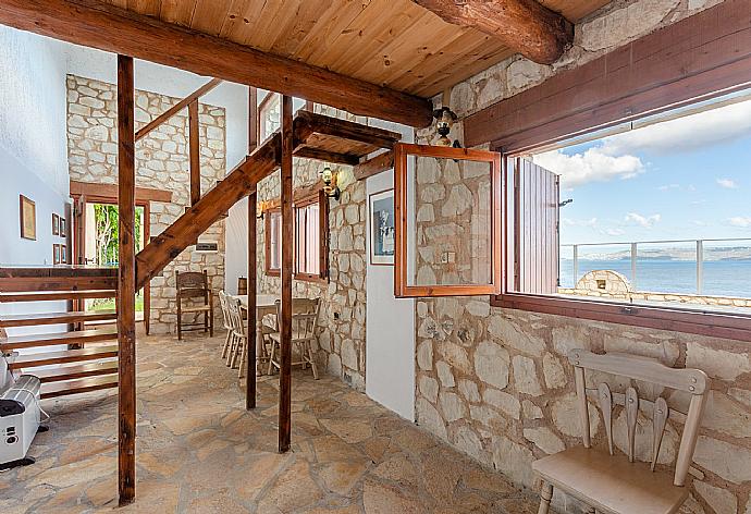 Self-contained apartment with open-plan living area, double bedroom on mezzanine, and pool-terrace access  . - Souda Bay View . (Galleria fotografica) }}