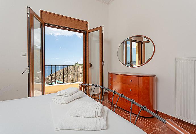 Double bedroom on first floor with A/C and balcony access . - Souda Bay View . (Photo Gallery) }}