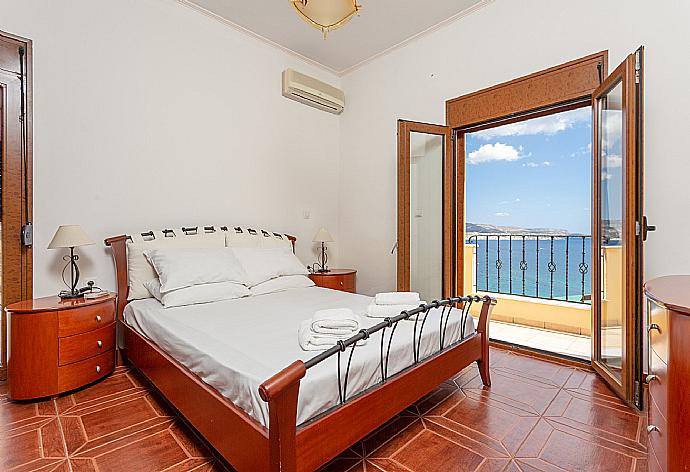 Double bedroom on first floor with A/C and balcony access . - Souda Bay View . (Photo Gallery) }}