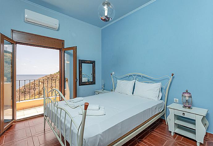 Double bedroom on first floor with A/C and balcony access . - Souda Bay View . (Photo Gallery) }}