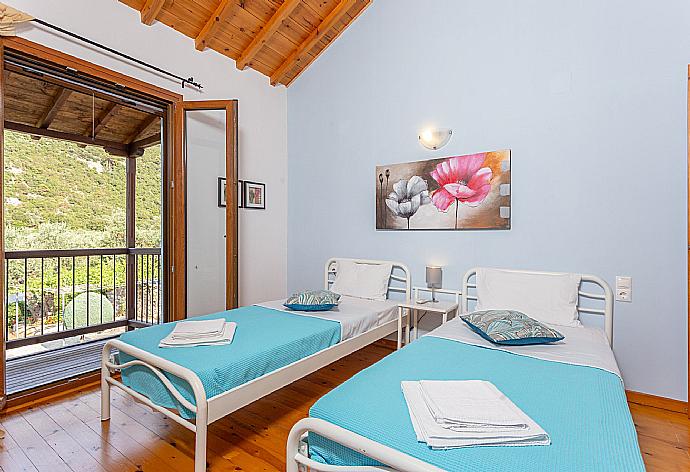 Twin bedroom with A/C and balcony . - Villa Glysteri . (Photo Gallery) }}