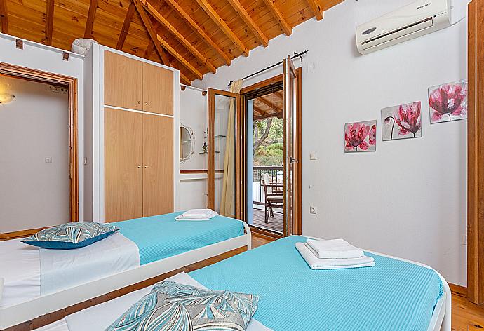 Twin bedroom with A/C and balcony . - Villa Glysteri . (Photo Gallery) }}