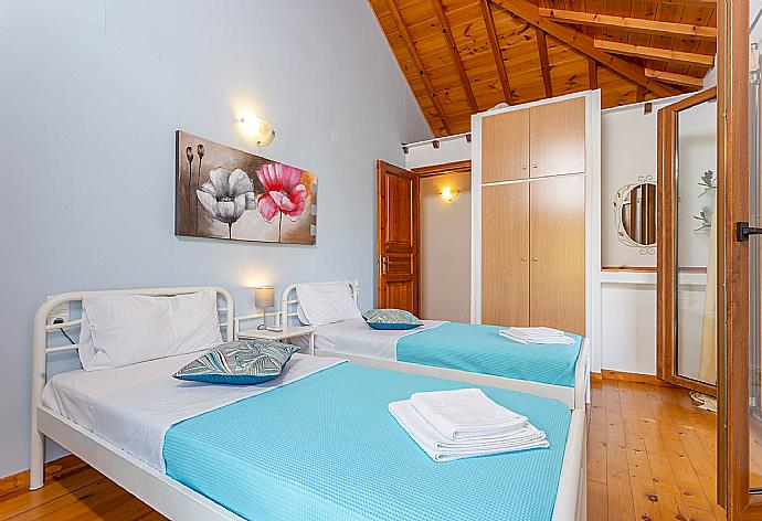 Twin bedroom with A/C and balcony . - Villa Glysteri . (Photo Gallery) }}