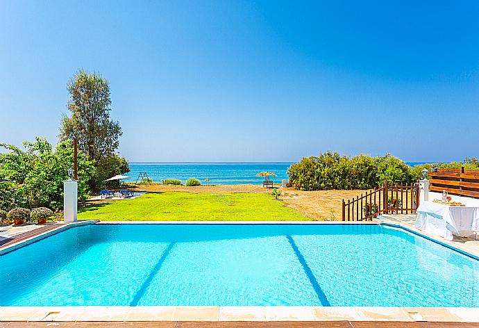 Private infinity pool, terrace, and garden with panoramic sea views . - Kalisto Beach Villa . (Photo Gallery) }}