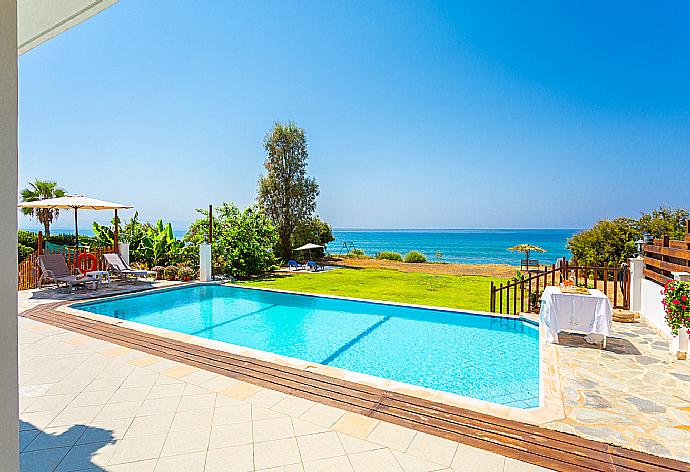 Private infinity pool, terrace, and garden with panoramic sea views . - Kalisto Beach Villa . (Photo Gallery) }}