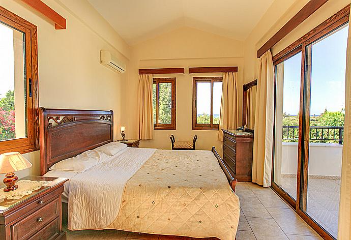 Double bedroom with A/C and balcony access . - Villa Solon . (Photo Gallery) }}