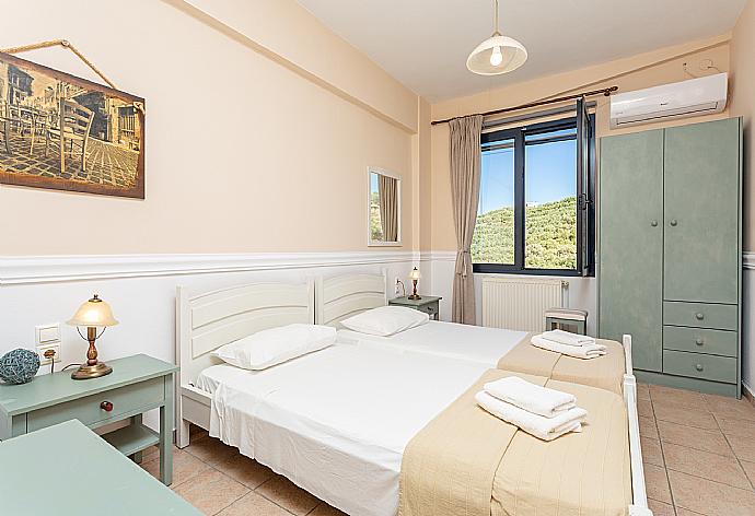 Twin bedroom with A/C . - Villa Dimitra . (Photo Gallery) }}