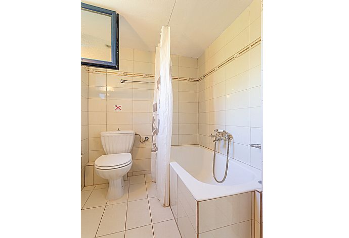 Family bathroom with bath and shower . - Villa Dimitra . (Galleria fotografica) }}