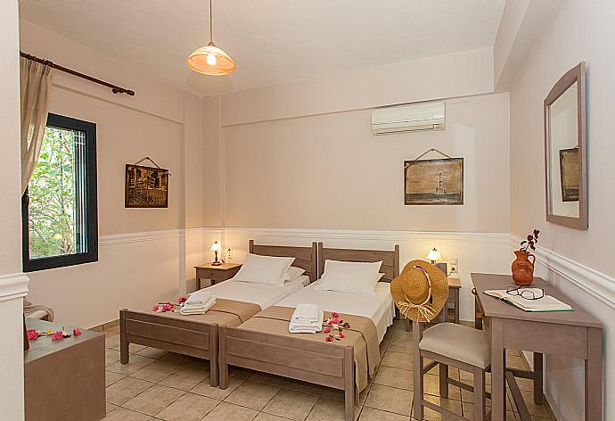 Twin bedroom with A/C . - Villa Manolis . (Photo Gallery) }}