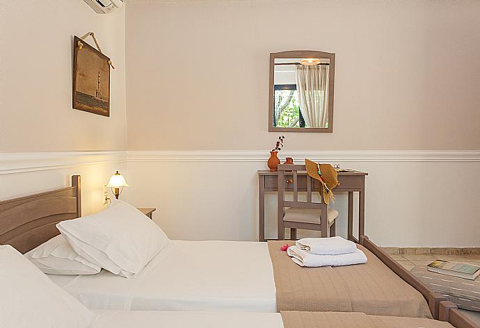 Twin bedroom with A/C . - Villa Manolis . (Photo Gallery) }}