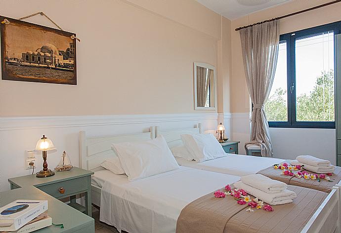 Twin bedroom with A/C . - Villa Manolis . (Photo Gallery) }}