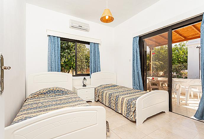 Twin bedroom with A/C and terrace access . - Villa Lela Tria . (Photo Gallery) }}