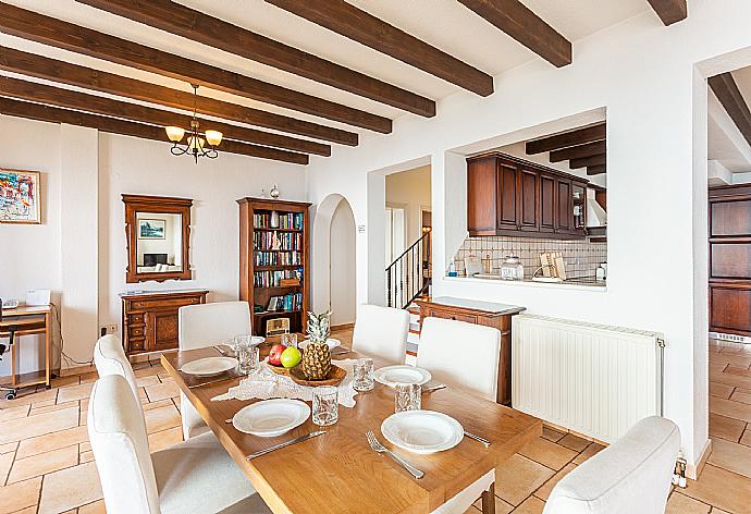 Open-plan living room with sofas, dining areas, kitchen, ornamental fireplace, WiFi internet, satellite TV, and terrace access with panoramic sea views . - Villa Emilios . (Galleria fotografica) }}