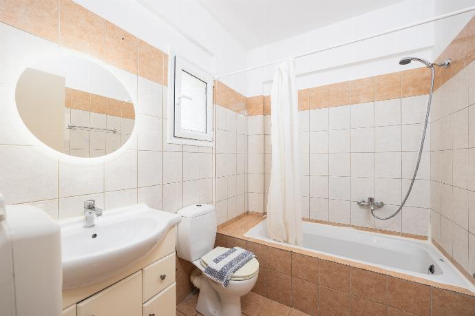 En suite bathroom with bath and shower . - Villa Cherry . (Photo Gallery) }}