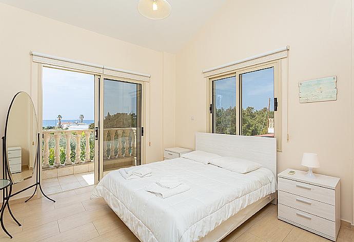 Double bedroom with en suite bathroom, A/C, sea views, and balcony access . - Villa Rose . (Photo Gallery) }}