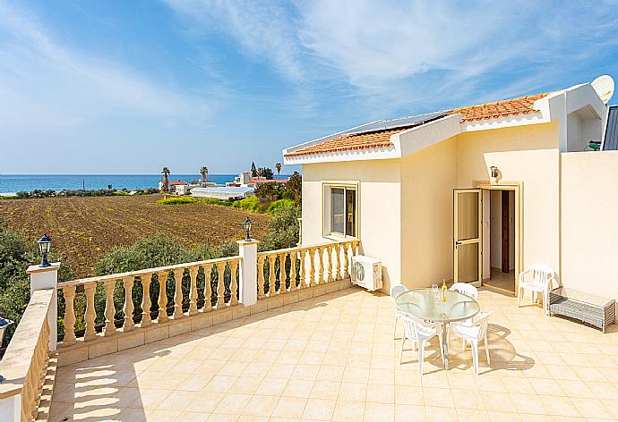 Upper terrace area with sea and countryside views . - Villa Rose . (Photo Gallery) }}