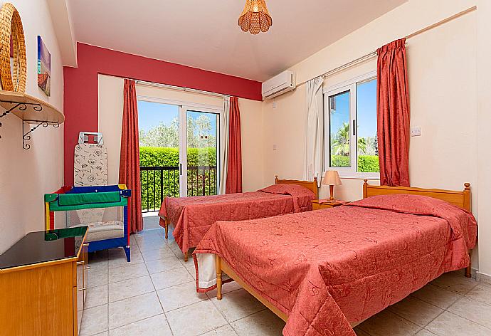 Twin bedroom with A/C and deck access . - Villa Chrystalla . (Photo Gallery) }}