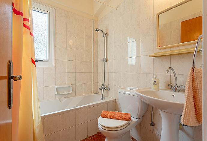 En suite bathroom with bath and shower . - Villa Christia Maris . (Photo Gallery) }}