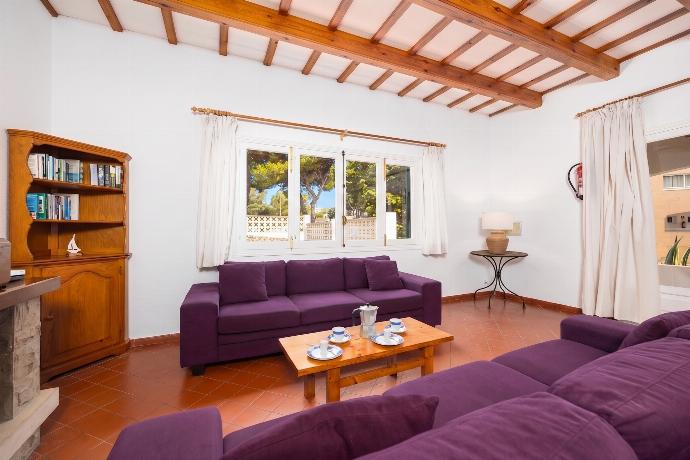 Living room with sofas, dining area, ornamental fireplace, WiFi internet, and satellite TV . - Villa Trepuco Uno . (Photo Gallery) }}