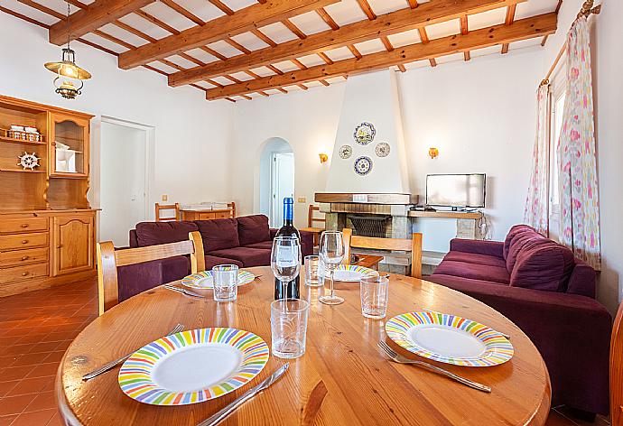 Living room with sofas, dining area, ornamental fireplace, WiFi internet, TV, and terrace access . - Villa Trepuco Dos . (Галерея фотографий) }}