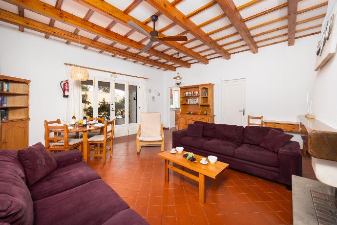 Living room with sofas, dining area, ornamental fireplace, WiFi internet, and satellite TV . - Villa Trepuco Dos . (Photo Gallery) }}