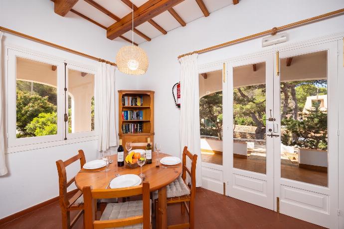Living room with sofas, dining area, ornamental fireplace, WiFi internet, and satellite TV . - Villa Trepuco Dos . (Photo Gallery) }}