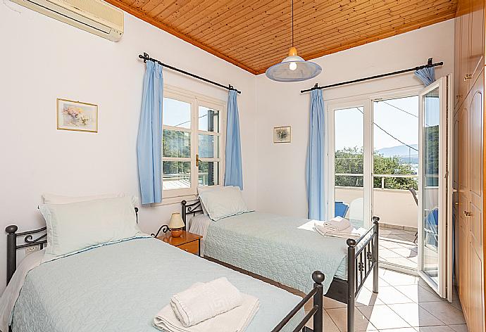 Twin bedroom with A/C and terrace access . - Theophilos 2 . (Photo Gallery) }}