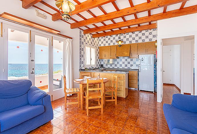 Open-plan living room with sofas, dining area, kitchen, WiFi internet, TV, and sea views . - Voramar Waterfront . (Photo Gallery) }}