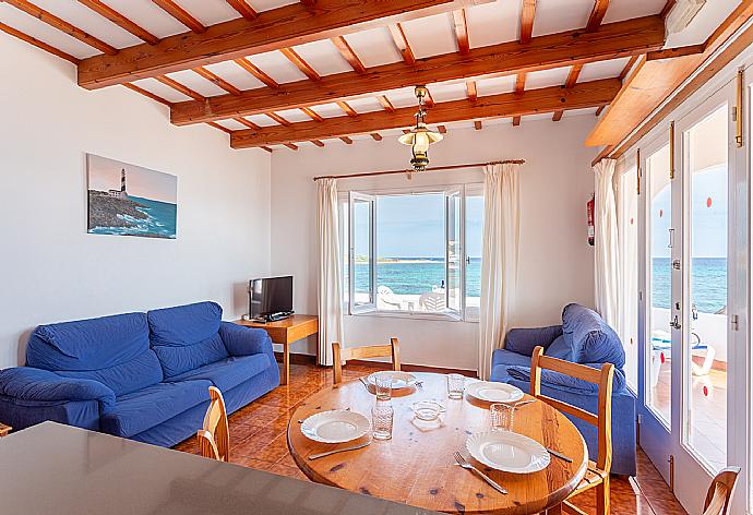 Open-plan living room with sofas, dining area, kitchen, WiFi internet, TV, and sea views . - Voramar Waterfront . (Photo Gallery) }}