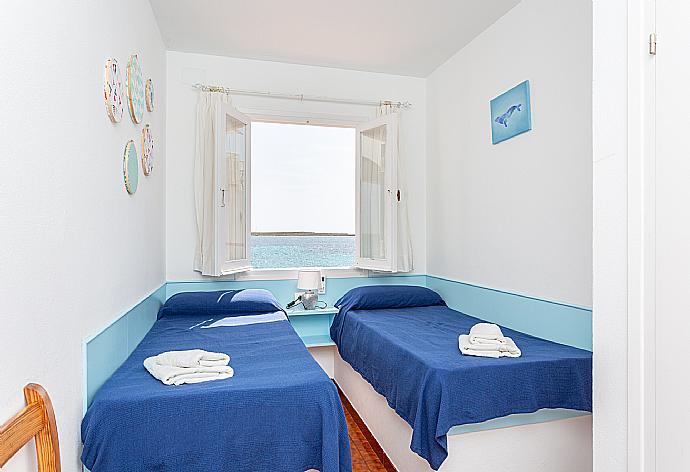 Twin bedroom with A/C and sea views . - Voramar Waterfront . (Photo Gallery) }}