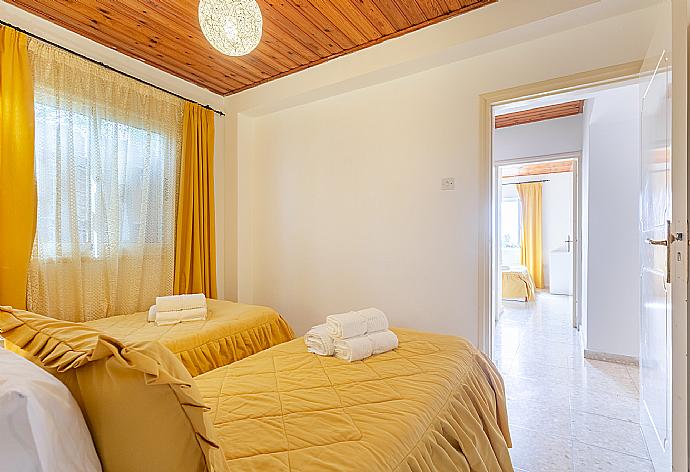 Twin bedroom with en suite bathroom and A/C . - Villa Constantinos . (Photo Gallery) }}