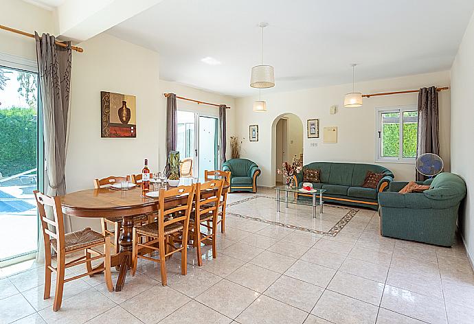 Open-plan living room with sofas, dining area, kitchen, WiFi internet, satellite TV, and terrace access . - Villa Zenon . (Galerie de photos) }}