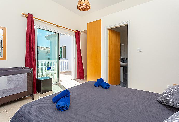 Double bedroom with en suite bathroom, A/C, and upper terrace access . - Villa Zenon . (Photo Gallery) }}