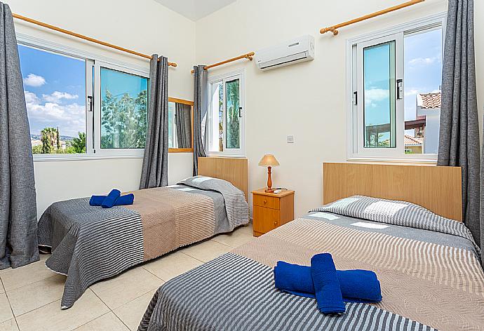 Twin bedroom with en suite bathroom, A/C, and upper terrace access . - Villa Zenon . (Photo Gallery) }}