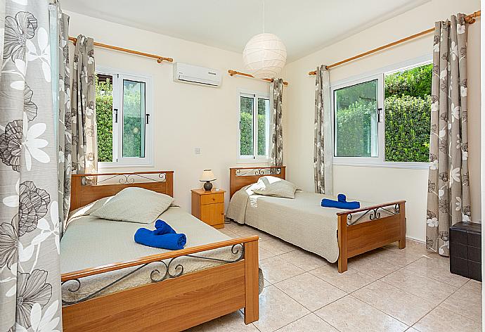 Twin bedroom with en suite bathroom, A/C, and terrace access . - Villa Zenon . (Photo Gallery) }}