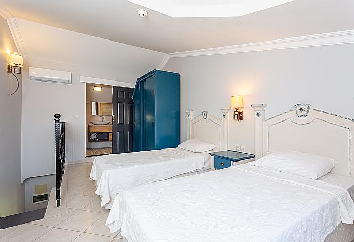 Twin bedroom with en suite bathroom and A/C . - Villa Derya Paradise . (Photo Gallery) }}