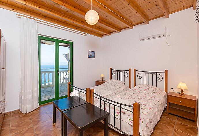 Twin bedroom with A/C and terrace access . - Villa Anastasia . (Photo Gallery) }}