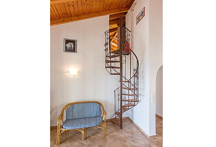 Spiral staircase to loft bedroom  . - Villa Anastasia . (Photo Gallery) }}