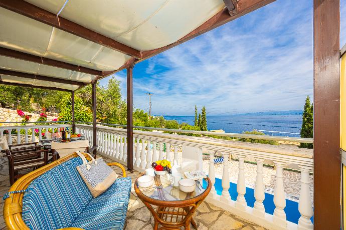 Sheltered terrace area with sea views . - Villa Anastasia . (Photo Gallery) }}