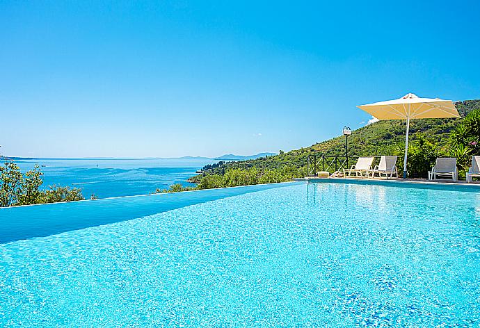 Private infinity pool, terraces, and gardens with panoramic sea views . - Villa Vasso . (Галерея фотографий) }}