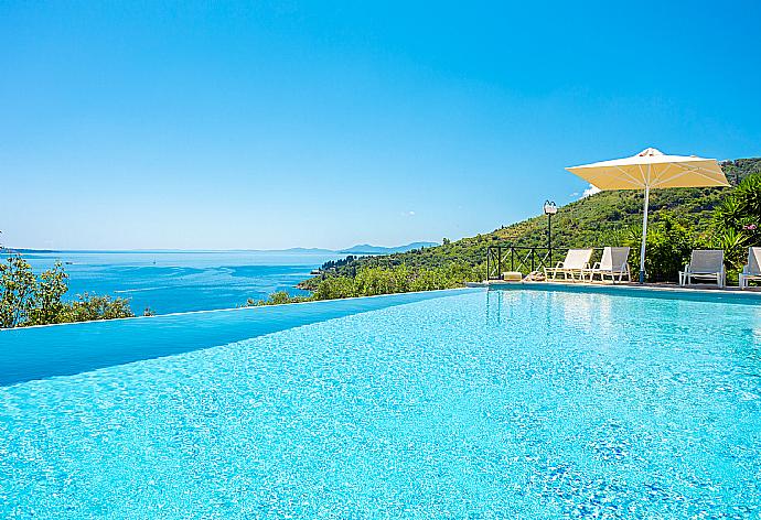 Private infinity pool, terraces, and gardens with panoramic sea views . - Villa Vasso . (Photo Gallery) }}